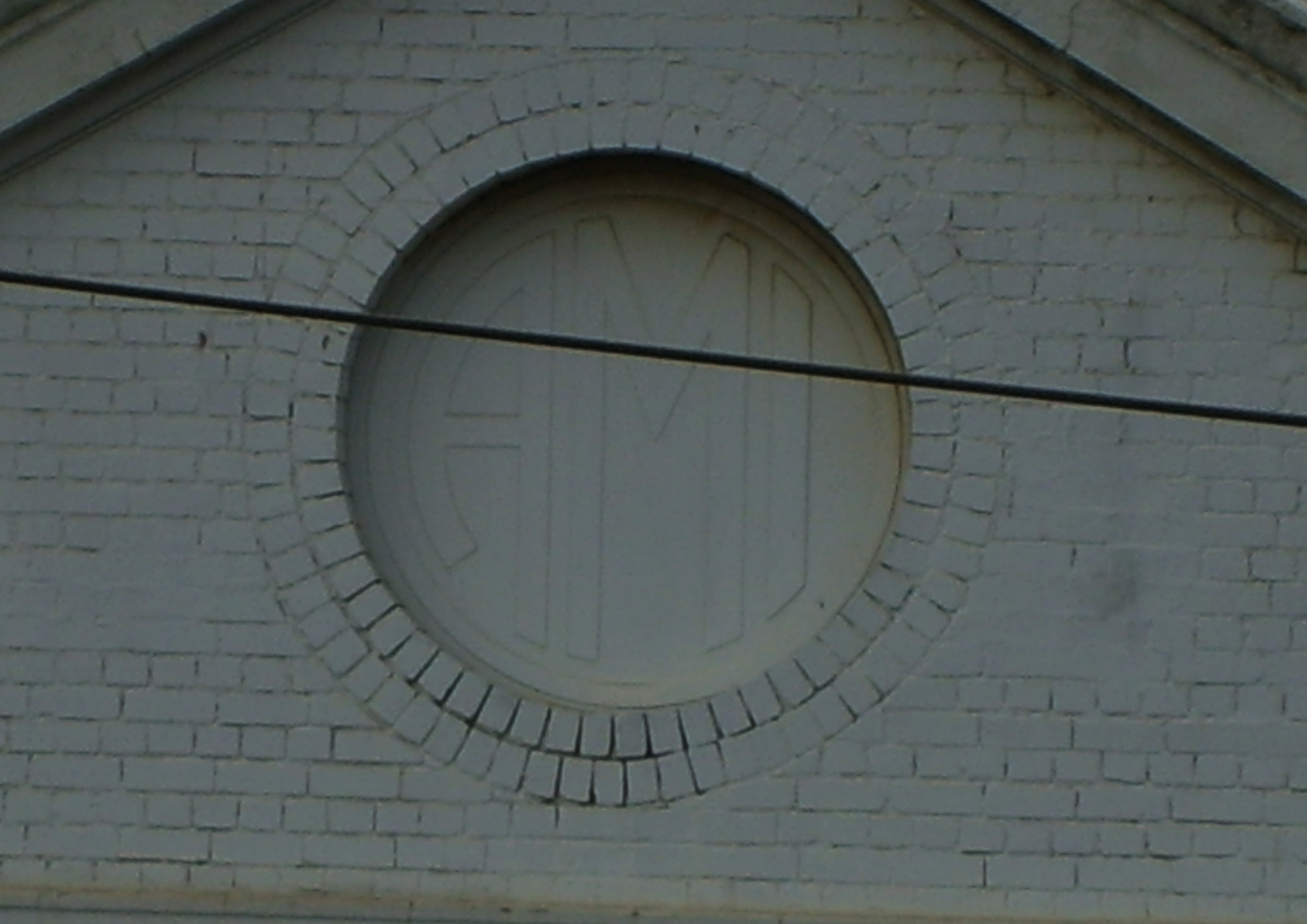 Australian Motor Industries logo on one of the remaining buildings Lancaster (2012)