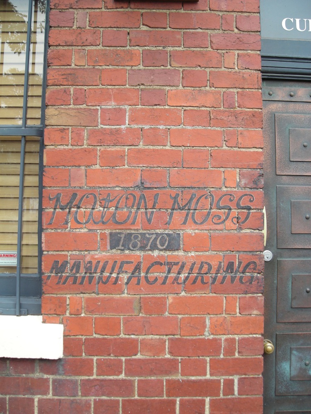 Signage for Moton Moss Manufacturing at the Cotton Mill